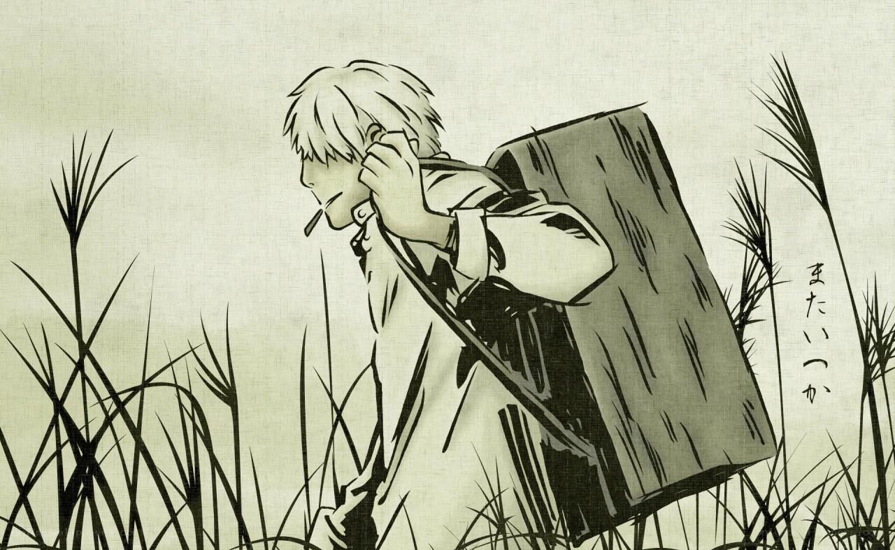 boy in tall grass with backpack