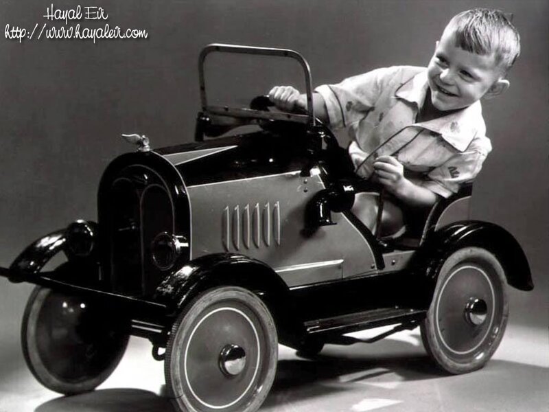 Boy in Toy Car