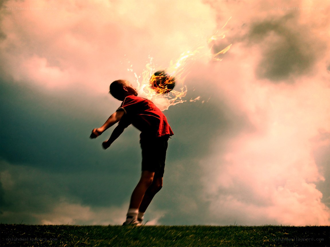 Boy kicking flaming ball
