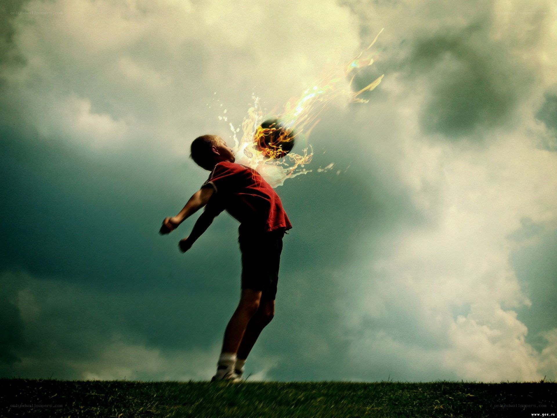 Boy kicking flaming ball