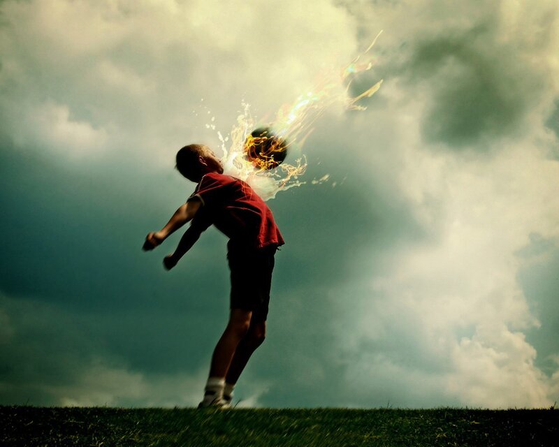 Boy kicking flaming ball