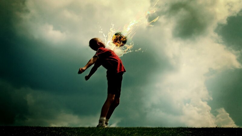 Boy kicking flaming ball