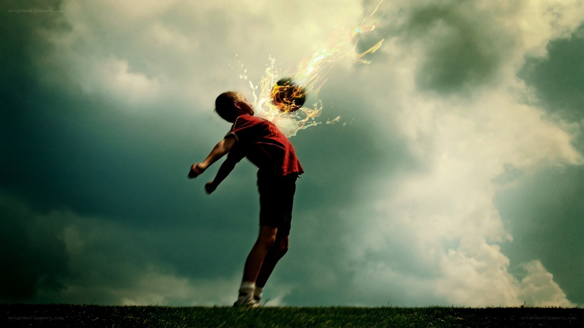 Boy kicking flaming ball