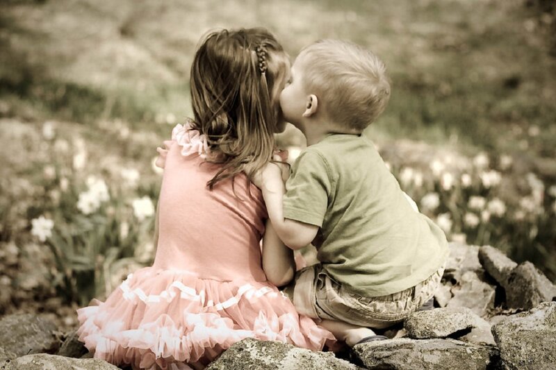 Boy Kissing Girl on Cheek
