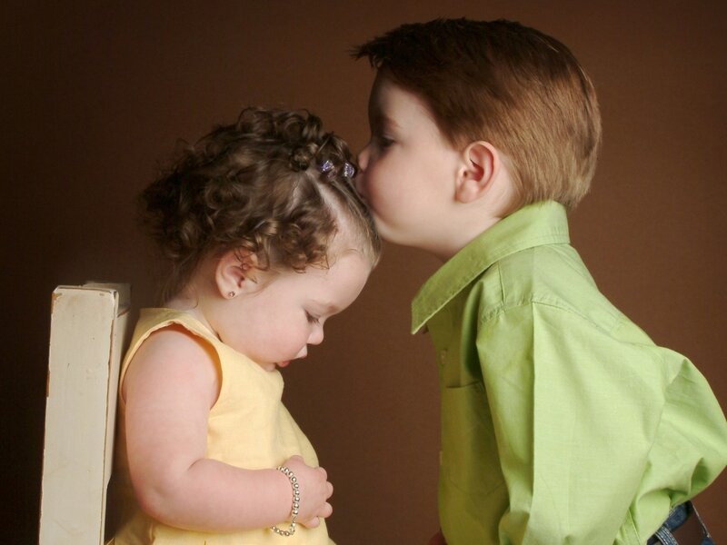 Boy Kissing Girl on Forehead — Brown, Tender
