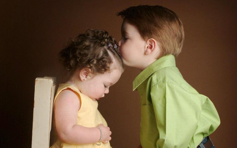 Boy Kissing Girl on Forehead — Brown