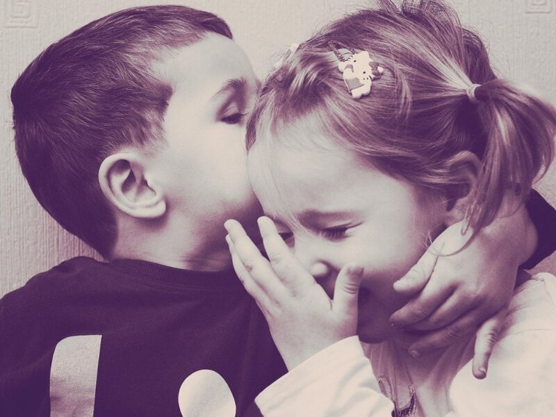 Boy Kissing Girl's Cheek