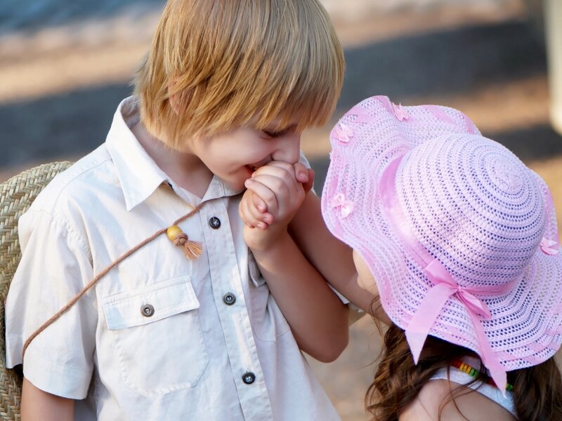 Boy Kissing Girl's Hand