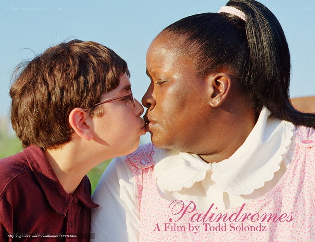 boy kissing woman on cheek
