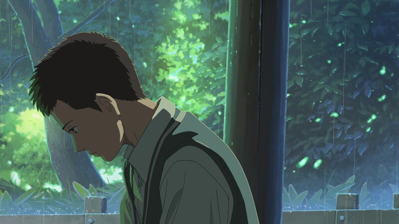 Boy Looking Down in Rain