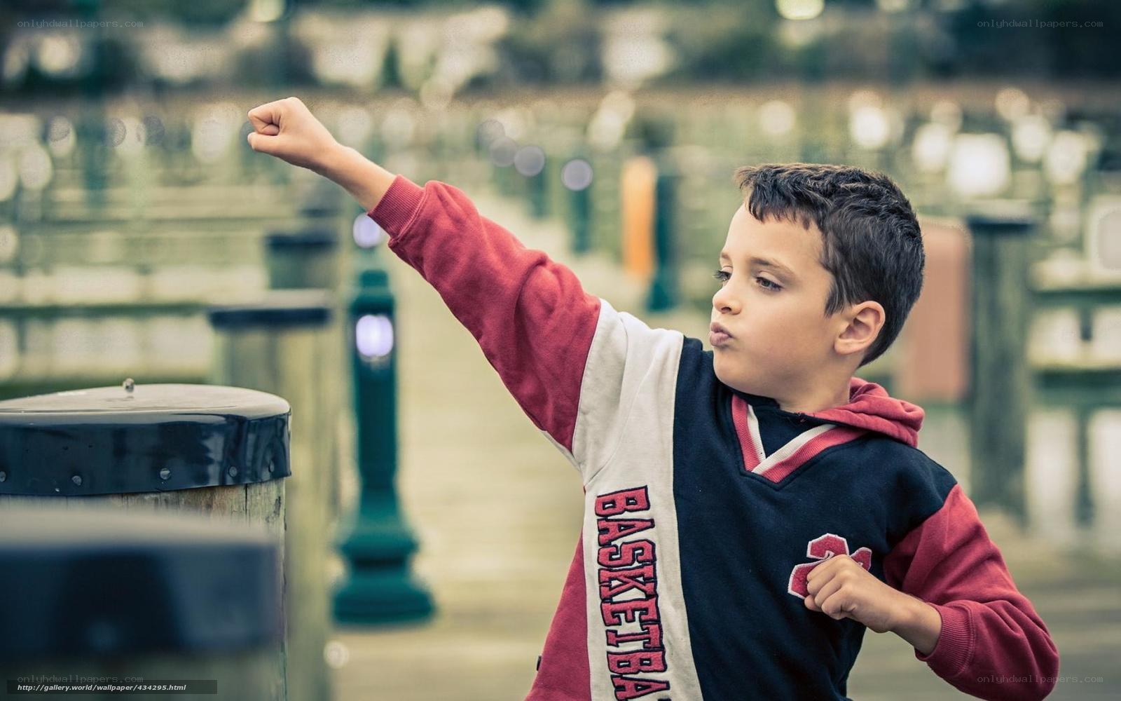 boy making a fist gesture