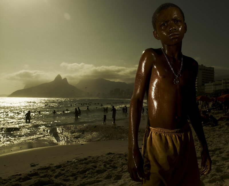 Boy on a beach at sunset