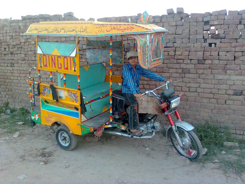 Boy on Motorized Rickshaw