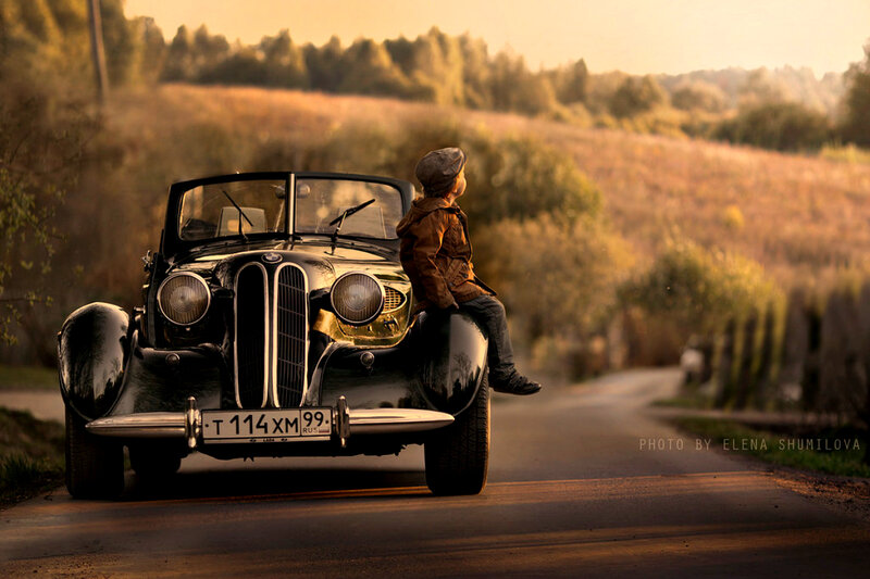 Boy on Vintage Car