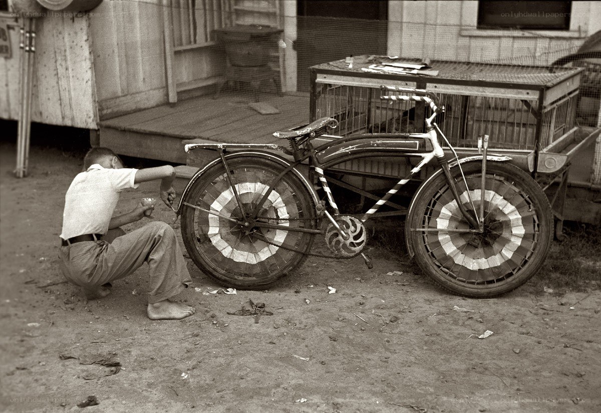 Boy painting a bicycle
