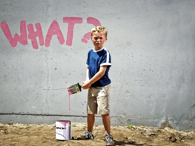 Boy Painting on Wall