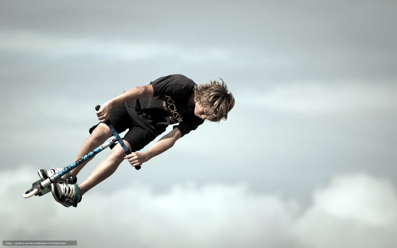 Boy performing scooter trick