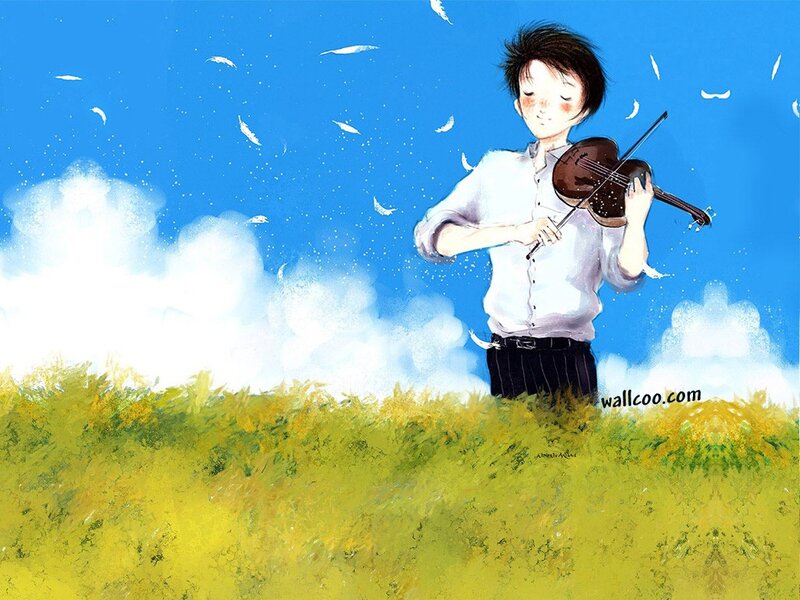 Boy playing violin in a field