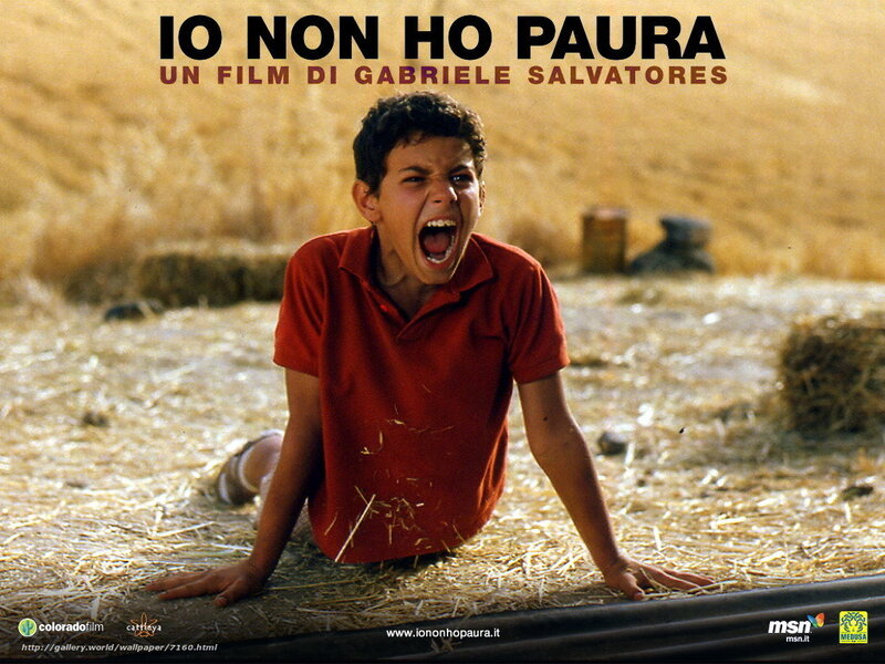 Boy screaming in field