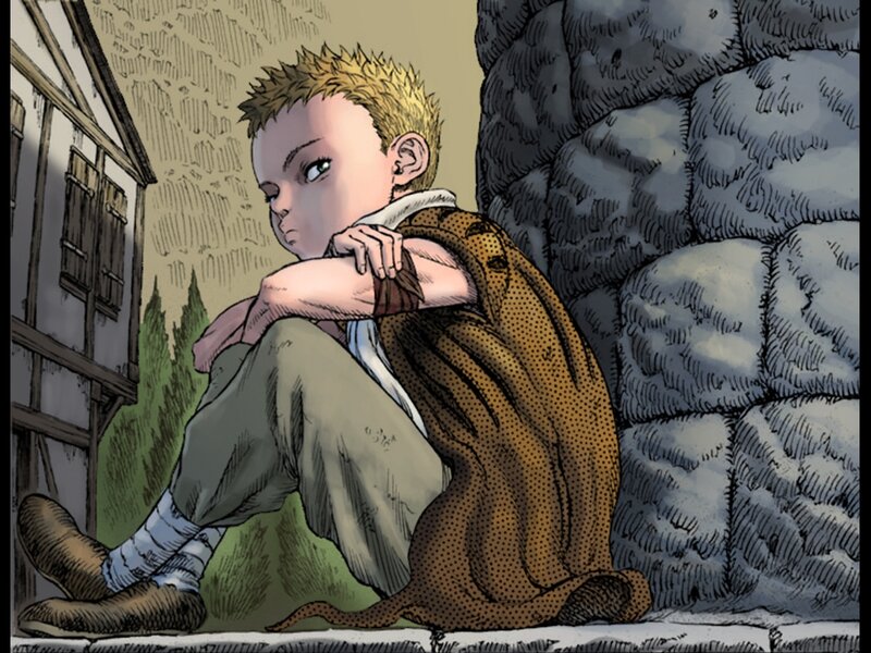 boy sitting against a wall