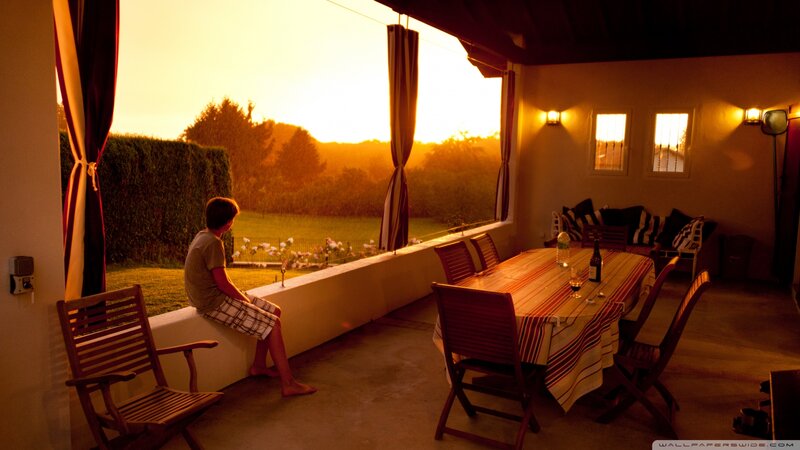 Boy Sitting on Patio