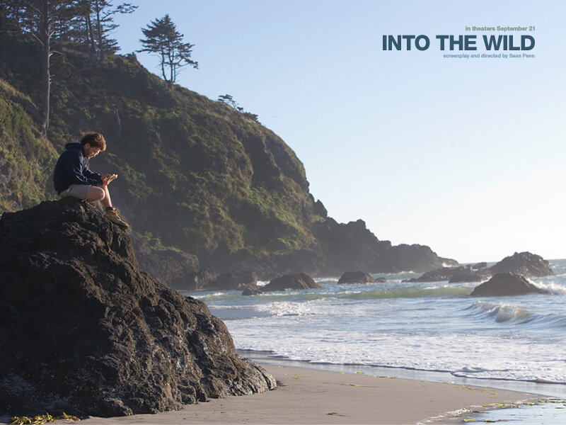 Boy Sitting on Rock
