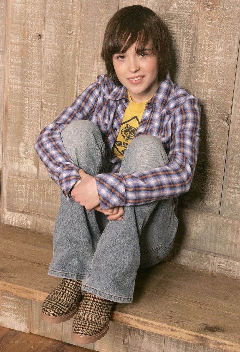 boy sitting on wooden steps