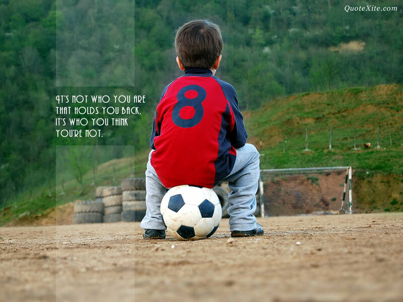 Boy Sitting with Soccer Ball