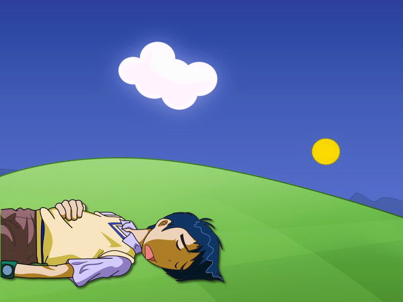 Boy sleeping on a hill