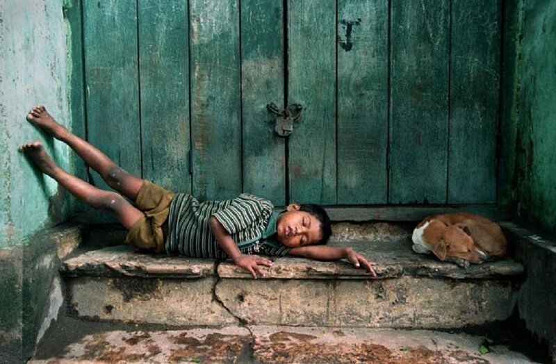 Boy Sleeping on Steps