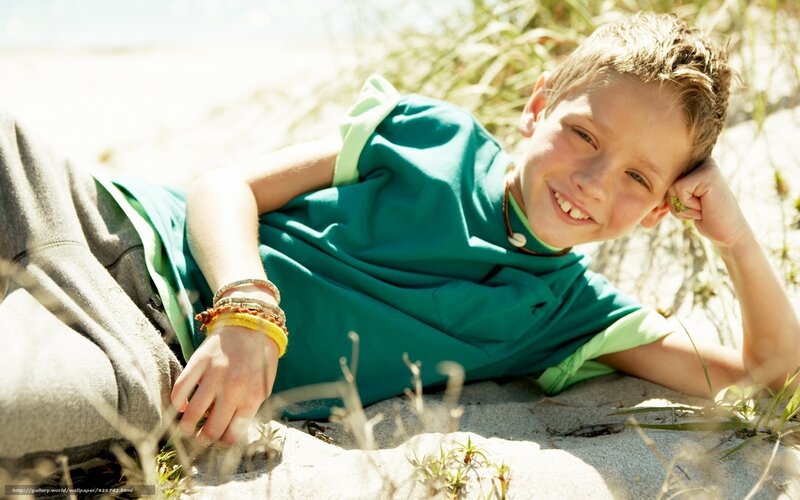 Boy smiling on the beach