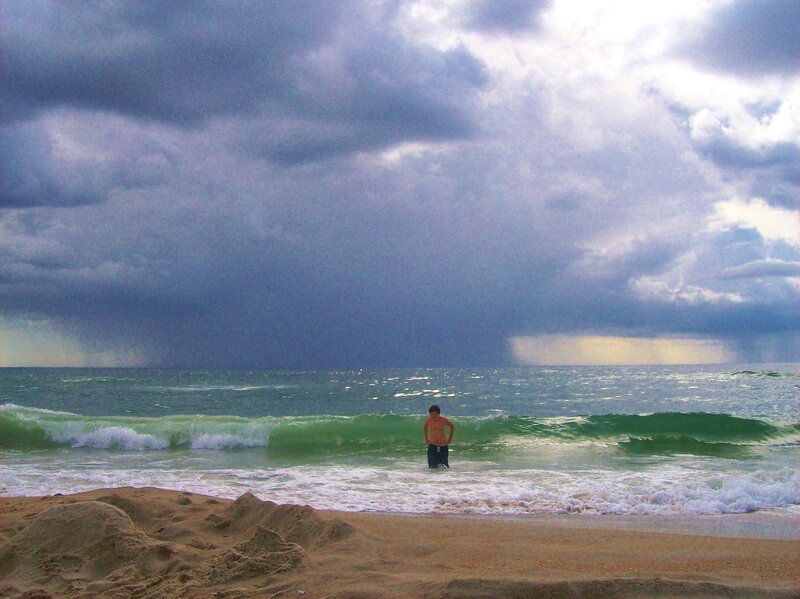 Boy Standing in Ocean