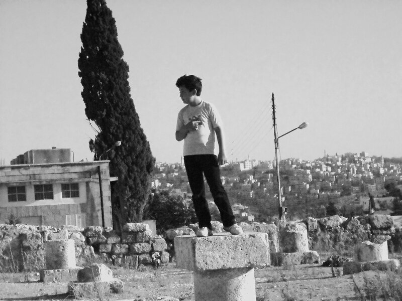 Boy Standing on Stone