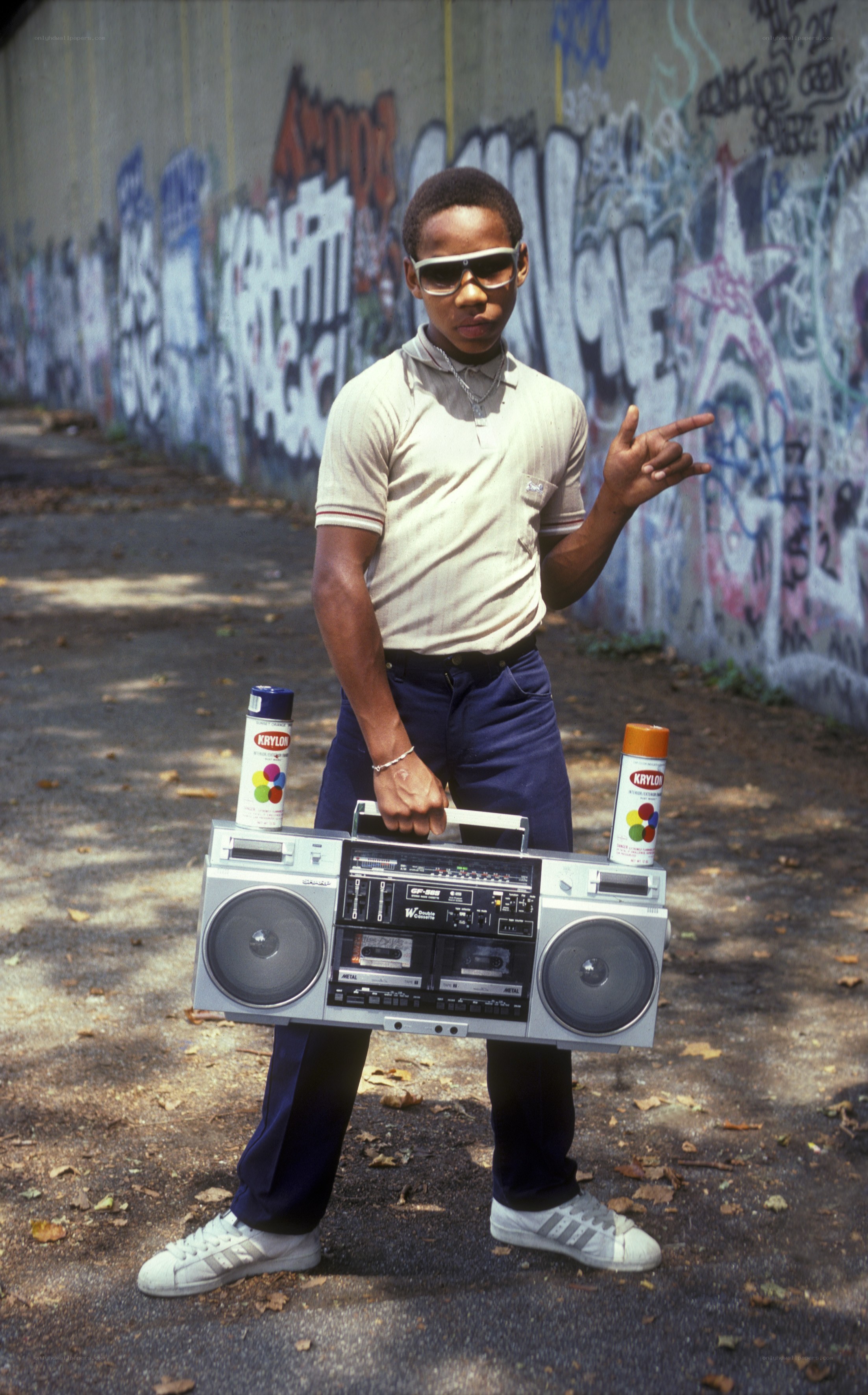 Boy with boombox and spray cans