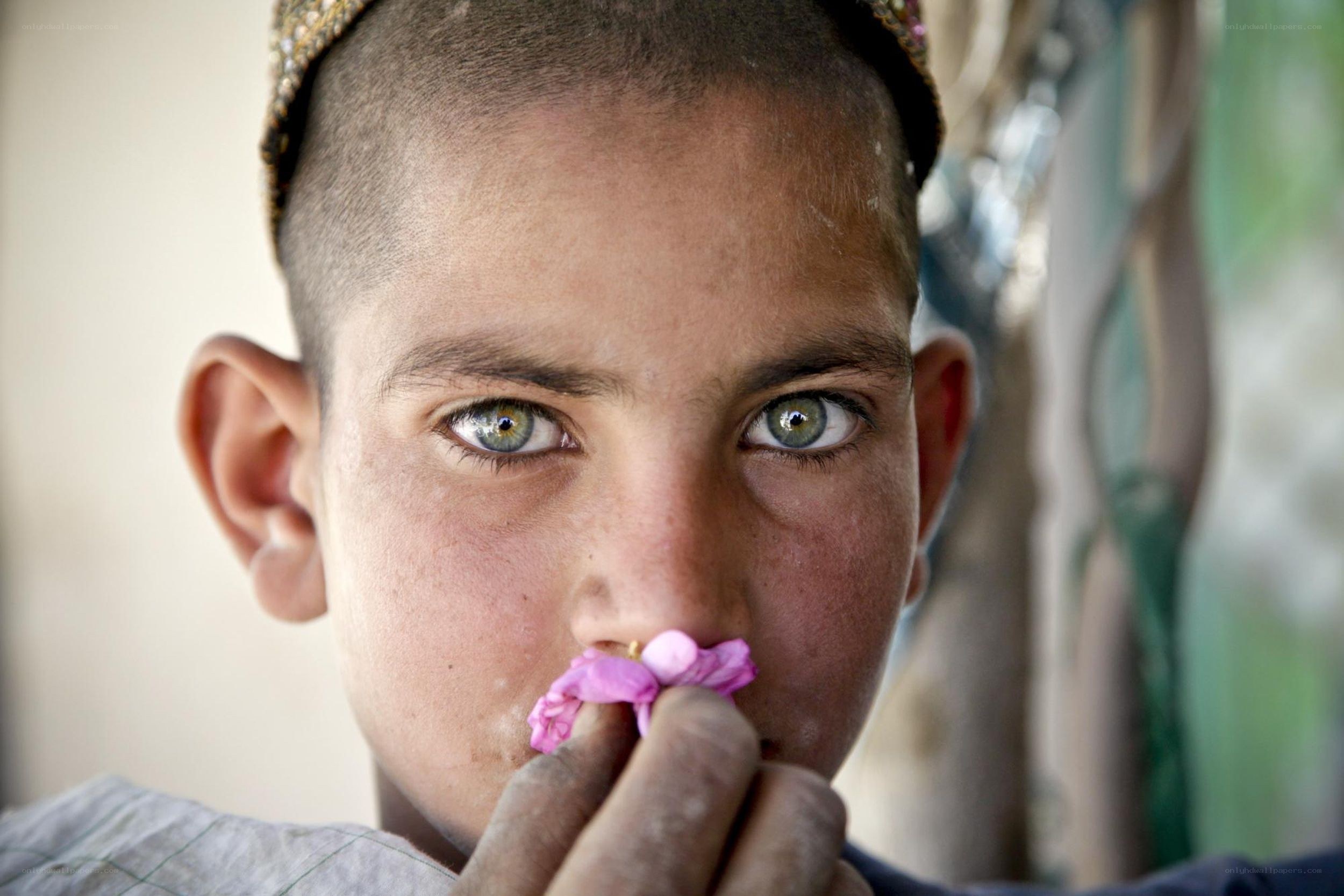 boy with flower in nose