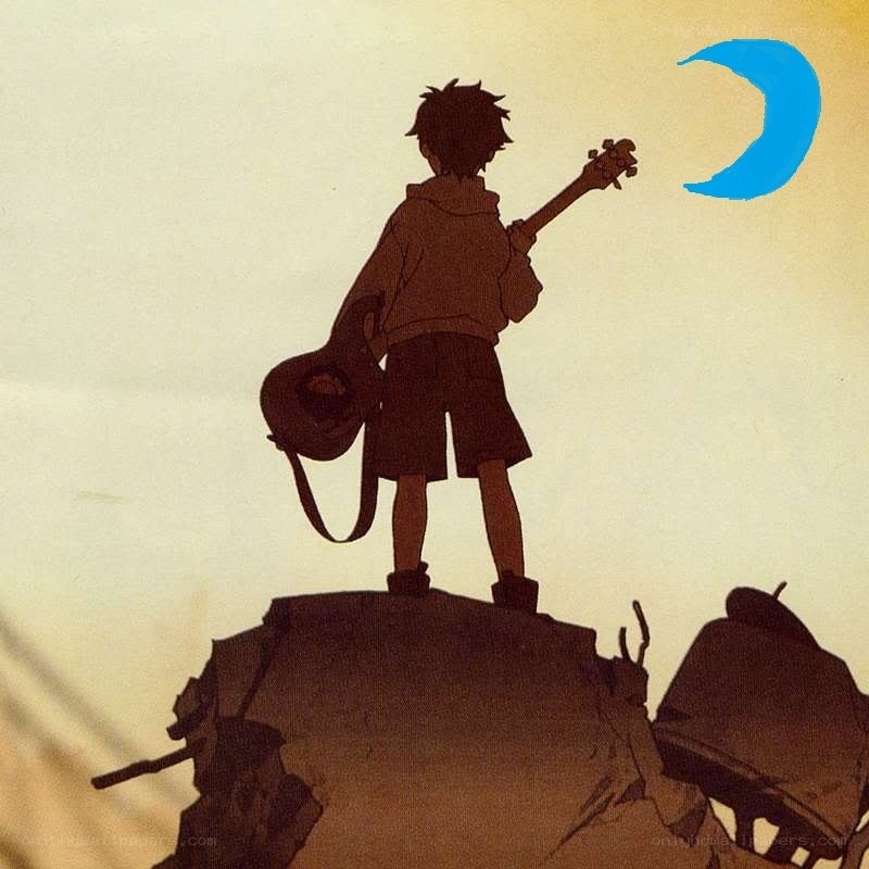 Boy with guitar on a hill