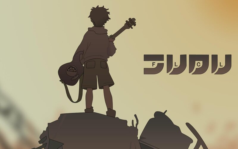 boy with guitar on rubble