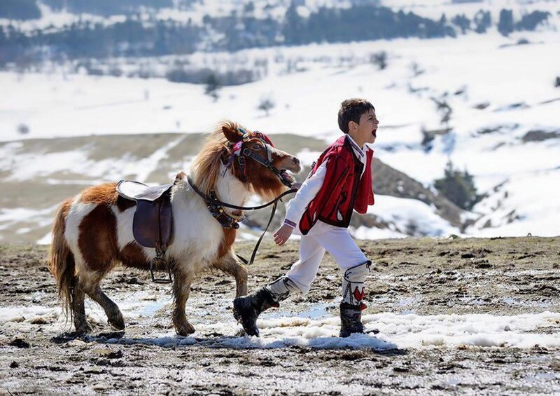 Boy with Pony in Snow