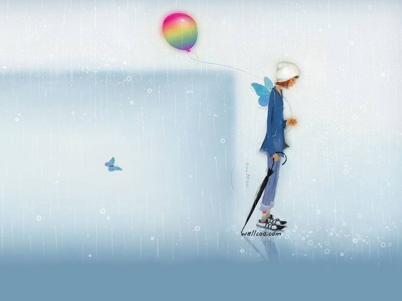 Boy with rainbow balloon in rain
