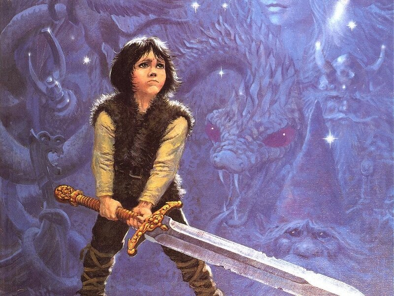 boy with sword facing dragon