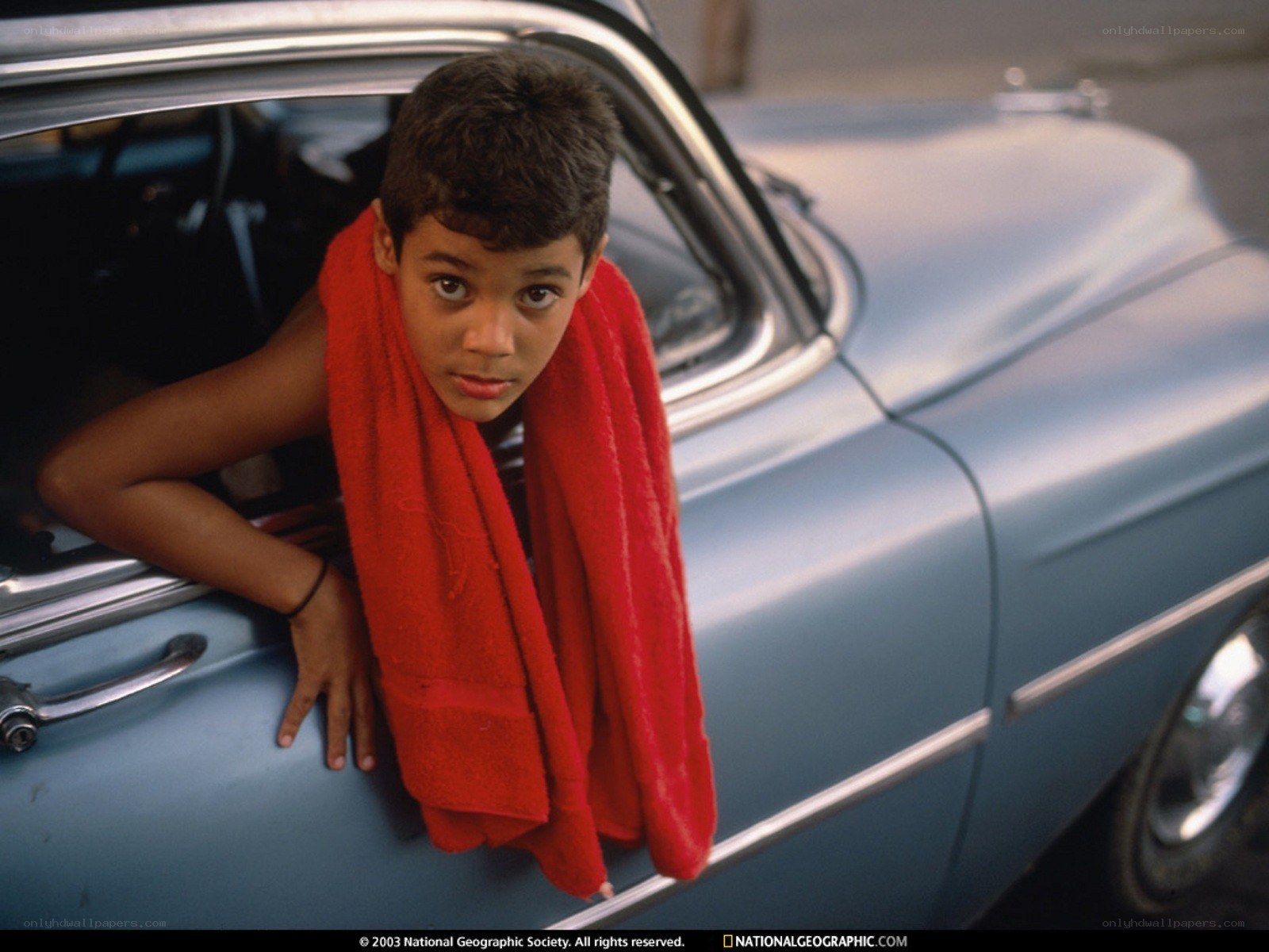 Boy with towel in car