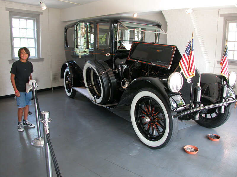 Boy with vintage car exhibit