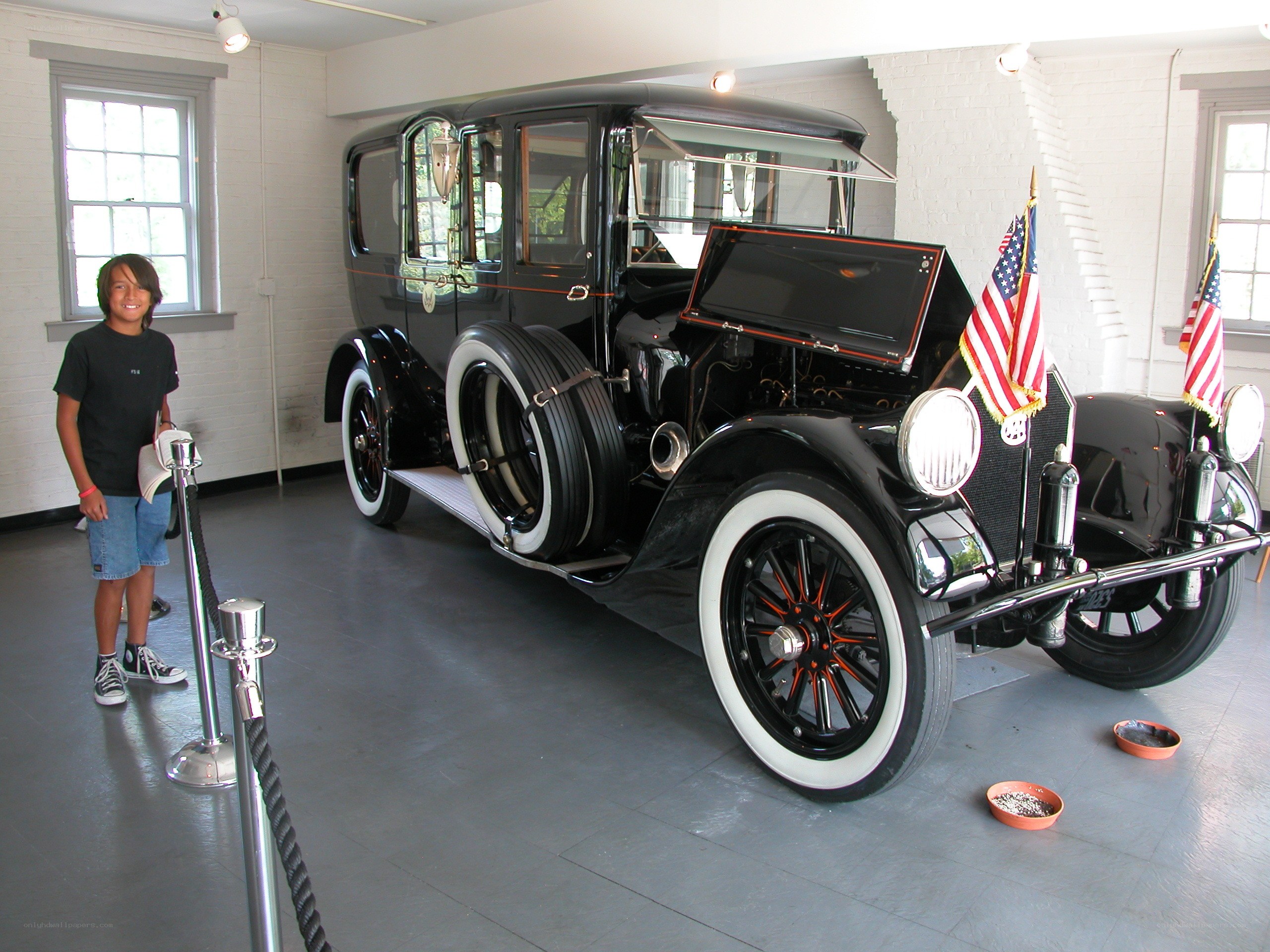 Boy with vintage car exhibit