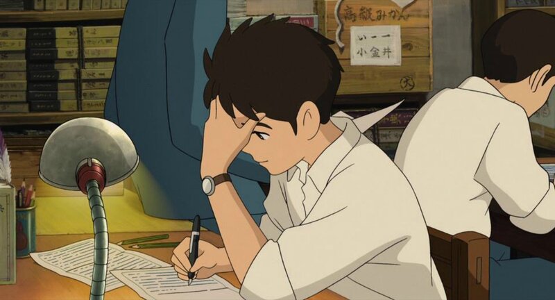 Boy Writing at Desk