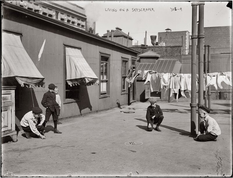 Boys playing in a courtyard