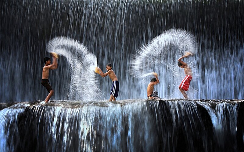 Boys Playing in Waterfall
