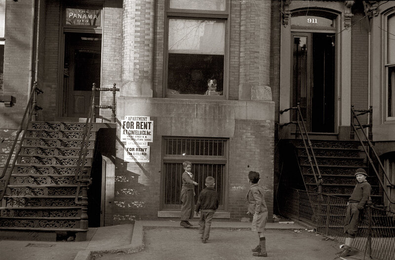 Boys playing on a city street