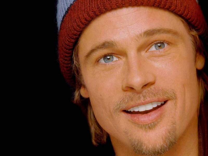Brad Pitt smiling in a beanie