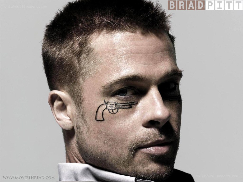 Brad Pitt with gun tattoo