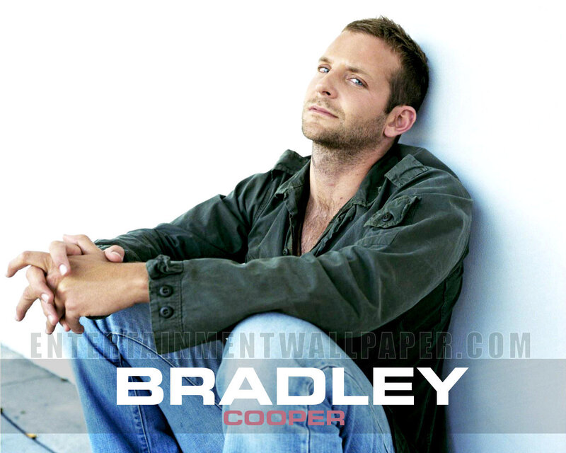 Bradley Cooper sitting against wall